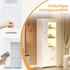 A collage showcasing a white, high-gloss display cabinet with LED lighting. One section shows a hand peeling protective film, another shows cleaning the cabinet, and the main section displays the illuminated cabinet with decorative items inside. Produktbild-Vorschau