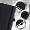 Collage of close-up shots of a black mini-notebook, highlighting its elastic band closure and page edges. Náhľad obrázku produktu