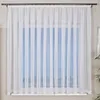 A white sheer curtain hangs in front of a window. Produktbild-Vorschau