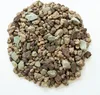 A pile of small, irregularly shaped stones of various colors, including brown, gray, and a muted green. Produktbild-Vorschau