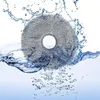 A round, gray cleaning pad is partially submerged in water, with water splashing around it and bubbles forming underneath. Produktbild-Vorschau