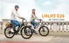 A man and a woman are riding electric bikes outdoors next to a railing. Produktbild-Vorschau