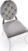 A single gray tufted chair with silver legs on a white background. Voir les images du produit
