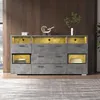 A modern gray sideboard with yellow LED lighting, set against a dark wood paneled wall and a light gray rug. Anteprima dell’immagine prodotto