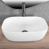 A white speckled basin with a modern faucet is shown on a wooden surface, with a textured gray wall behind it. Náhľad obrázku produktu
