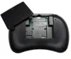 The back of a black wireless keyboard with the battery cover open, revealing the battery compartment. Anteprima dell’immagine prodotto