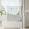 A modern bathroom with a bathtub and a glass shower screen. Produktbild-Vorschau