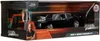 A toy model of a black Dodge Charger R/T from Fast & Furious, with a Dom Toretto figure, displayed in its retail packaging. Náhľad obrázku produktu