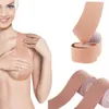 A woman is shown wearing breast lifting tape, with rolls of the tape also displayed. Náhled obrázku produktu