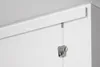 A close-up view of a white picture rail system mounted on a white wall and ceiling, with a perlon cord and a picture hook hanging from it. Voir les images du produit