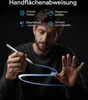 A man is holding a stylus and interacting with a digital interface, with glowing lines indicating digital interaction. Produktbild-Vorschau