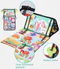 A baby play mat is shown unfolded and partially folded, with close-up insets highlighting features. Produktbild-Vorschau
