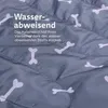Close-up of a gray fabric with a bone pattern, showing water droplets on the surface. Podgląd zdjęcia produktu