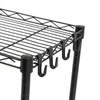 A close-up view of the side of a black wire shelving unit, showing the hooks attached to the underside of a shelf. Náhled obrázku produktu