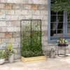 A planter box with a trellis and climbing plants, set against a brick wall next to a window. Voir les images du produit