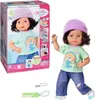 A doll and its packaging are displayed together, with accessories shown separately. Produktbild-Vorschau