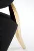 A close-up shot of the base of a black chair with a gold accent. Podgląd zdjęcia produktu