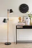 A modern living room scene with a floor lamp and a console table. Náhled obrázku produktu