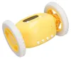 A yellow alarm clock with wheels is shown against a white background. Podgląd zdjęcia produktu