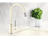 A kitchen faucet is shown in a sink with a small plant in a pot. Produktbild-Vorschau