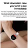 A person's arm wearing a smartwatch, with text describing its features. Produktbild-Vorschau