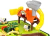 A toy farm playset with a tractor, cows, and a barn structure. Produktbild-Vorschau