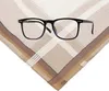 A pair of black-rimmed glasses rests on a folded handkerchief with a plaid pattern. Produktbild-Vorschau