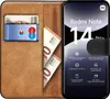A book-style phone case with a phone inside, showing cards and banknotes in the wallet section. Anteprima dell’immagine prodotto