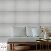 A modern living room with a couch and coffee table in front of a striped wall. Anteprima dell’immagine prodotto