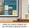 A digital display showing various widgets like calendar, weather, and notes, placed on a wooden surface next to a candle. Anteprima dell’immagine prodotto