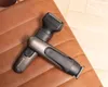 Two Remington hair trimmers are placed diagonally on a brown quilted surface. Produktbild-Vorschau