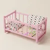 Ein Puppenbett aus Holz, eine rosa Wiege mit grauer Produktbild-Vorschau 2