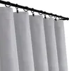 A row of grey curtains hanging from a black curtain rod. Produktbild-Vorschau