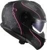 A black motorcycle helmet with pink and gray decorative patterns, shown from a side-diagonal angle. Náhled obrázku produktu