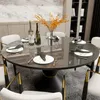 A dining table set with plates, wine bottles, and a floral centerpiece. Anteprima dell’immagine prodotto