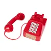 A red novelty telephone with a handset is shown against a white background. Podgląd zdjęcia produktu