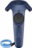 A blue HTC Vive VR controller with a black circular touchpad and a blue wrist strap. Produktbild-Vorschau