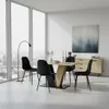 A dining set with a wooden table and black chairs in a modern room with large windows. Produktbild-Vorschau