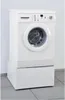 A white washing machine with a drawer unit underneath, placed on a tiled floor against a white wall. Anteprima dell’immagine prodotto