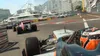 Formula 1 race cars on a city street circuit with yachts and buildings in the background. Produktbild-Vorschau