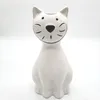 A white ceramic cat figurine on a white background. Podgląd zdjęcia produktu