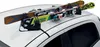 A ski and snowboard rack mounted on the roof of a white car. Náhled obrázku produktu