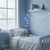 A child's bedroom decorated with a winter theme, featuring a bed, window, and wall decorations. Náhled obrázku produktu