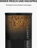 A close-up of a pet food dispenser filled with kibble, with text overlays. Produktbild-Vorschau