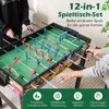 People playing foosball on a multi-game table. Podgląd zdjęcia produktu