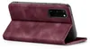 A burgundy flip cover case for a smartphone is shown from the side, propped open. Produktbild-Vorschau