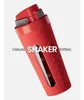 A red shaker bottle is shown against a white background with text overlay. Voir les images du produit