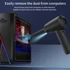 A black air duster is shown cleaning the inside of a computer case, with blue arrows indicating airflow and dust removal. Náhled obrázku produktu