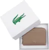 A taupe Lacoste coin wallet is presented in its white branded box, which features the iconic green Lacoste crocodile logo. Voir les images du produit