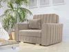 A beige sofa with a pillow in a room with plants and a brick wall. Náhled obrázku produktu